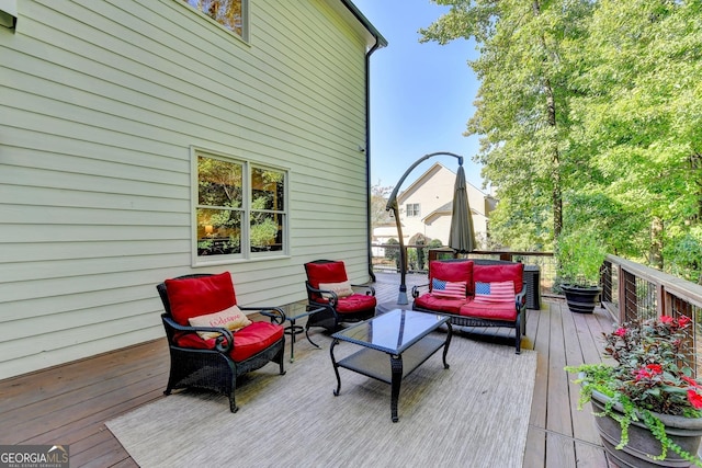 wooden terrace featuring an outdoor hangout area