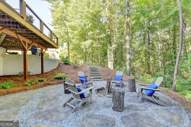 view of patio / terrace with a fire pit