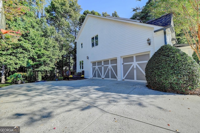 view of property exterior with a garage