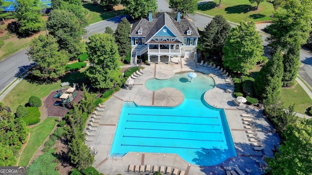 view of swimming pool with a patio area