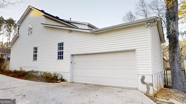 view of property exterior with a garage