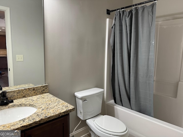 full bathroom with vanity, toilet, and shower / tub combo with curtain