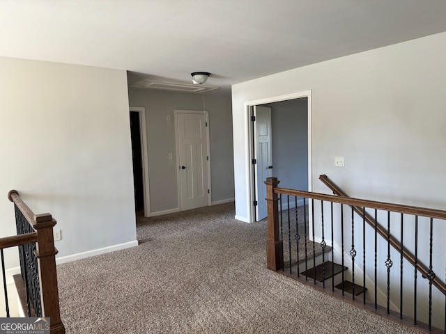 hallway with carpet flooring