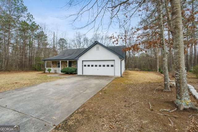 view of home's exterior with a porch and a garage