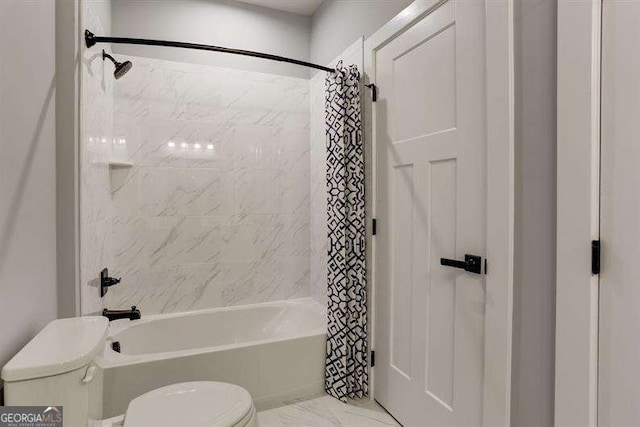 bathroom with shower / tub combo with curtain and toilet