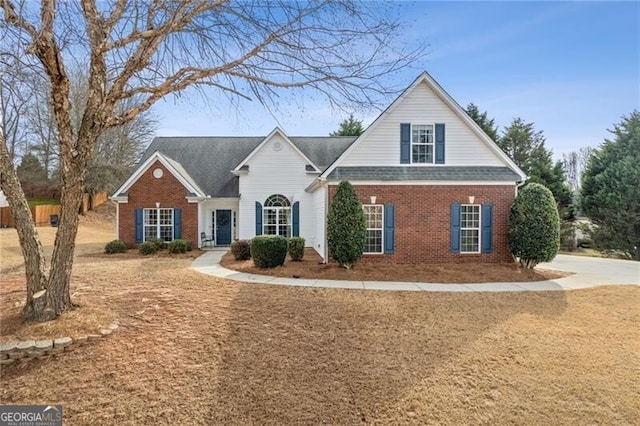 traditional home featuring brick siding