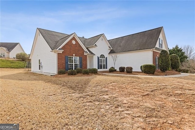 view of front of house featuring brick siding