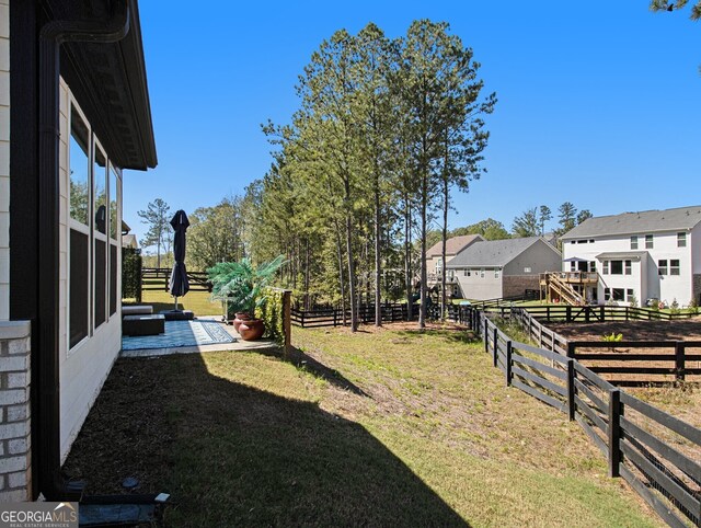 view of side of property featuring a lawn