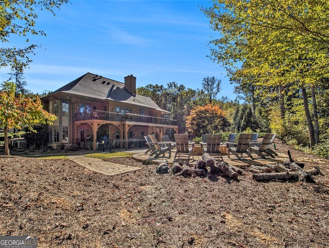 view of patio / terrace with an outdoor fire pit