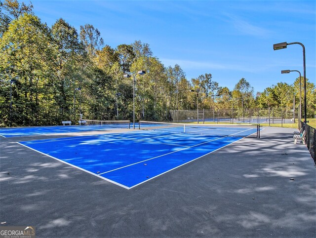 view of tennis court with basketball court