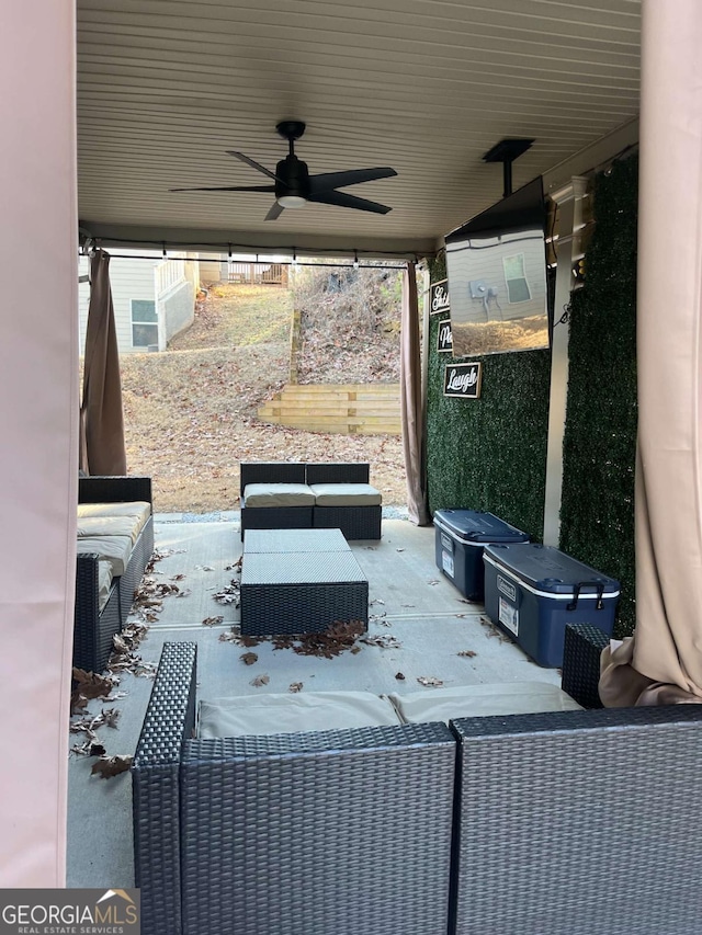 view of patio featuring ceiling fan