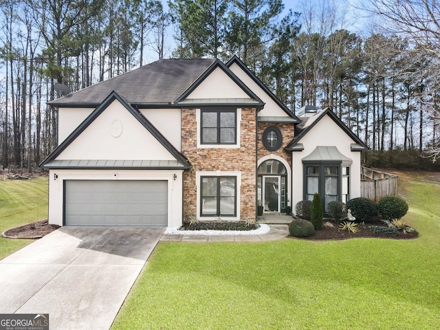 view of front of house featuring a garage and a front yard