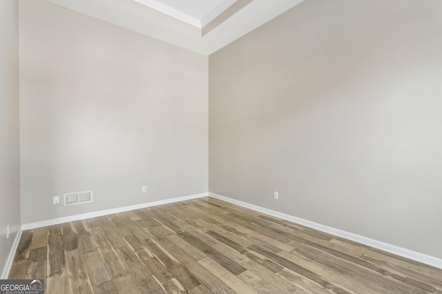 unfurnished room featuring hardwood / wood-style floors