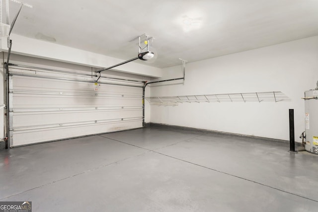 garage featuring a garage door opener and gas water heater