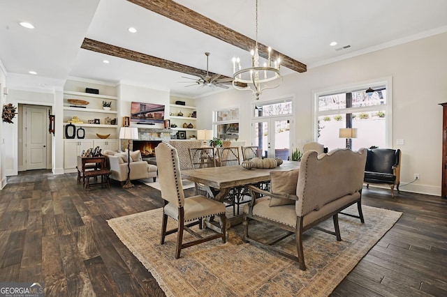 dining area with an inviting chandelier, beam ceiling, ornamental molding, dark hardwood / wood-style flooring, and french doors