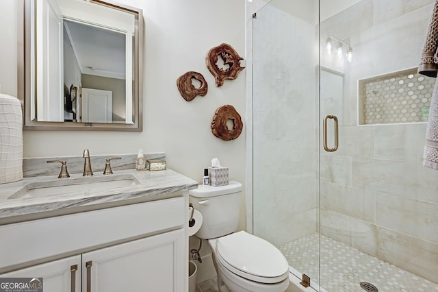 bathroom featuring walk in shower, vanity, and toilet