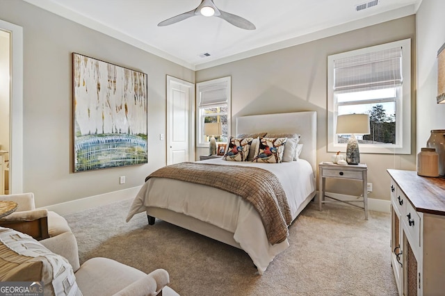 bedroom featuring light carpet and ceiling fan