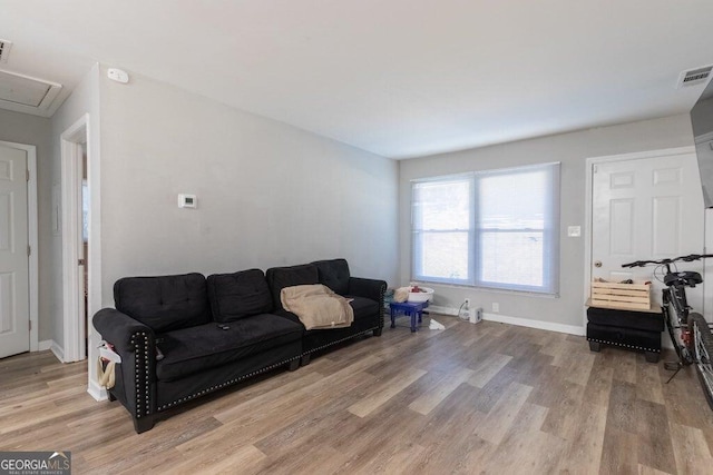 living room with light hardwood / wood-style floors