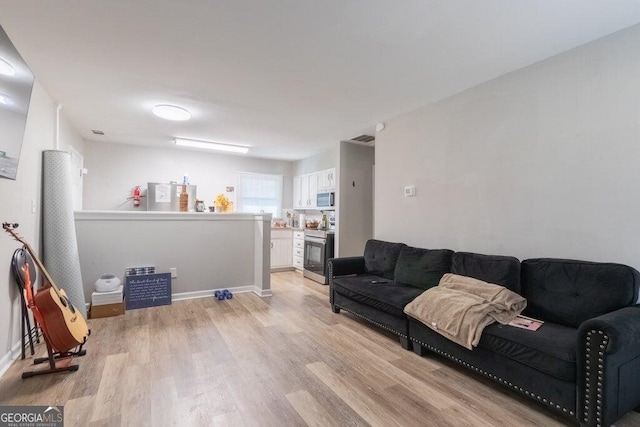 living room with light hardwood / wood-style floors