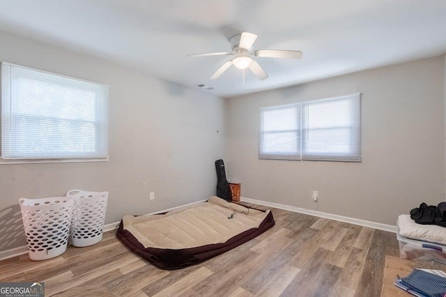 interior space with ceiling fan and light wood-type flooring