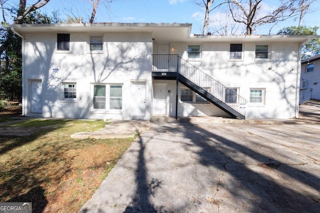 rear view of property featuring a patio area