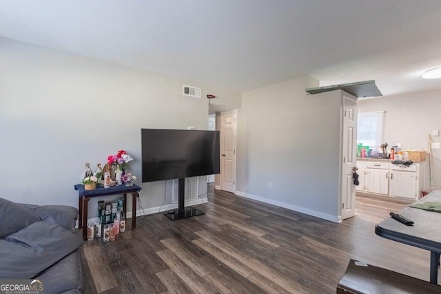 living room with dark hardwood / wood-style floors