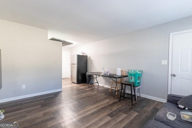 dining room with dark wood-type flooring