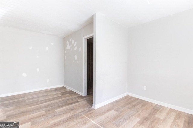 unfurnished room featuring light hardwood / wood-style flooring