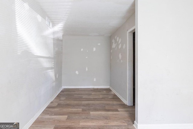 empty room featuring hardwood / wood-style flooring