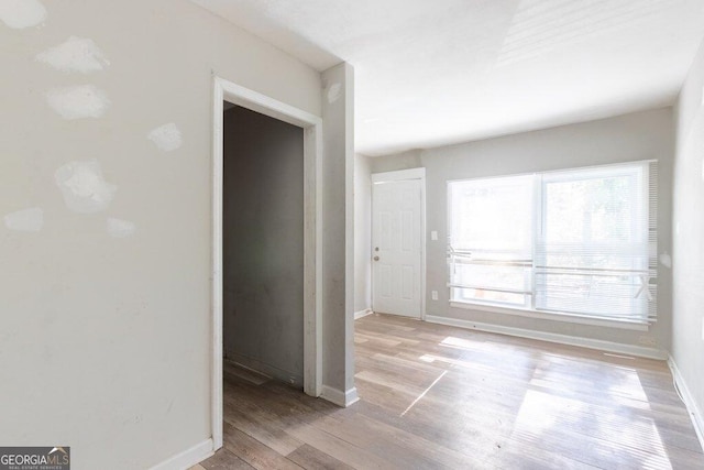 spare room featuring light hardwood / wood-style floors