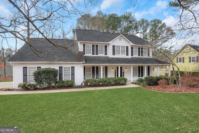 view of front of house featuring a porch and a front yard