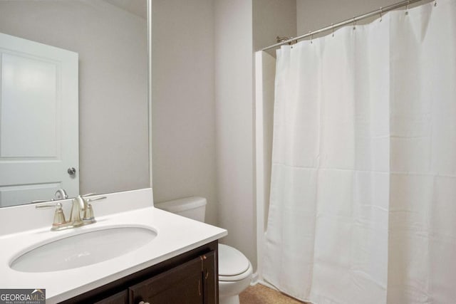 bathroom featuring vanity and toilet