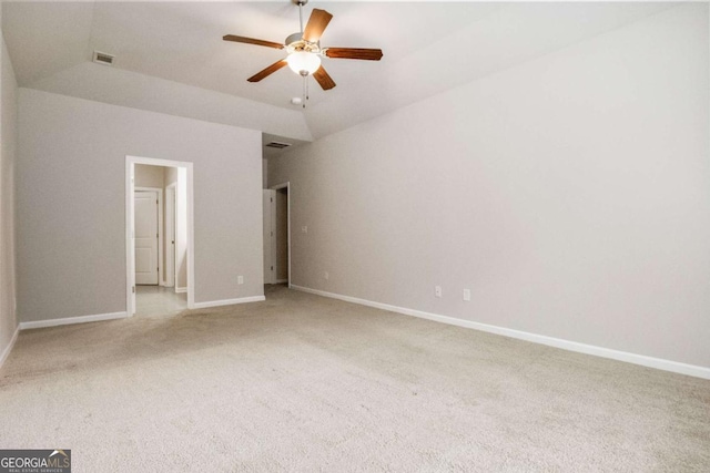 unfurnished bedroom with ceiling fan, lofted ceiling, and light carpet