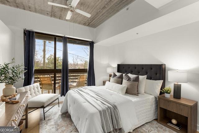 bedroom featuring access to outside, ceiling fan, and light hardwood / wood-style flooring