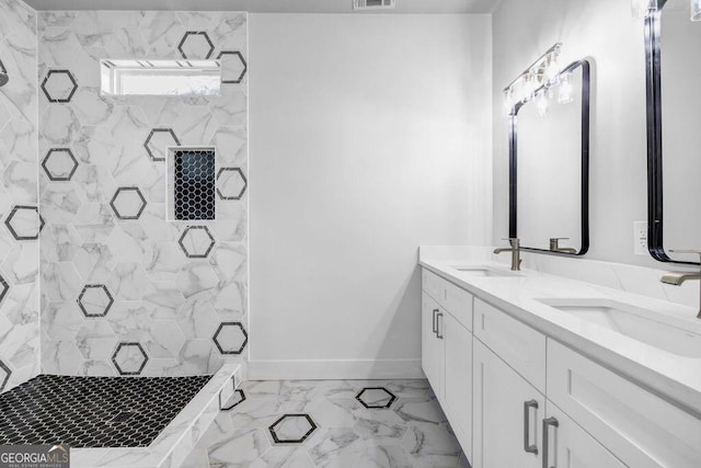 bathroom featuring vanity and a shower with door