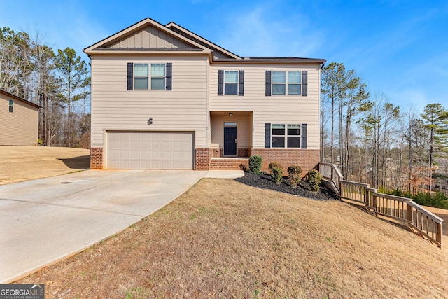 view of front of house featuring a garage and a front lawn