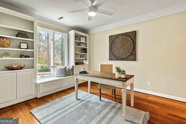 office featuring ornamental molding, ceiling fan, and light hardwood / wood-style floors