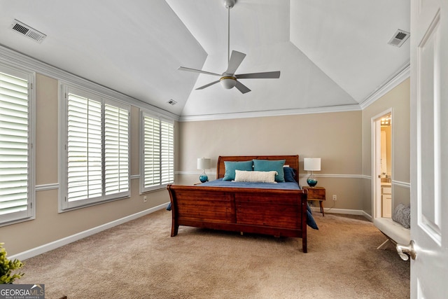 carpeted bedroom with lofted ceiling, crown molding, and ceiling fan