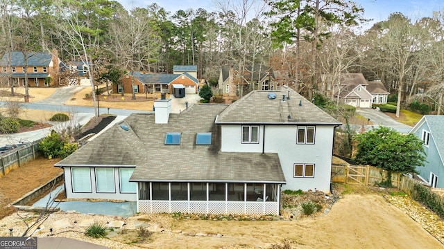 back of property featuring a sunroom