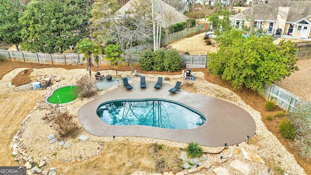 view of swimming pool featuring a patio