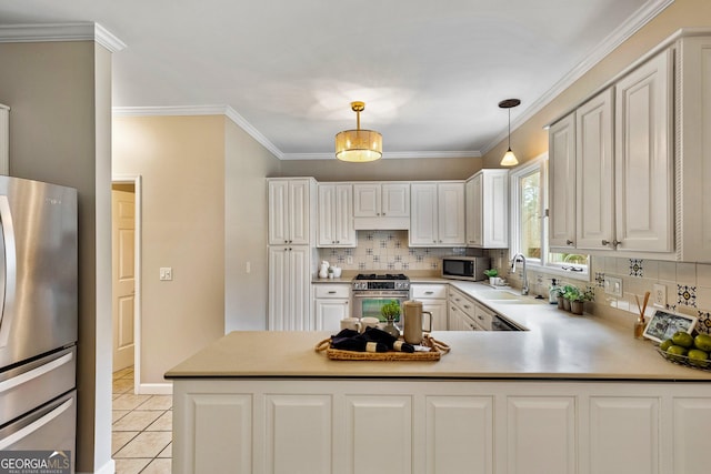 kitchen featuring light tile patterned flooring, sink, pendant lighting, stainless steel appliances, and white cabinets