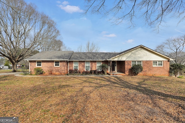 ranch-style house with a front yard