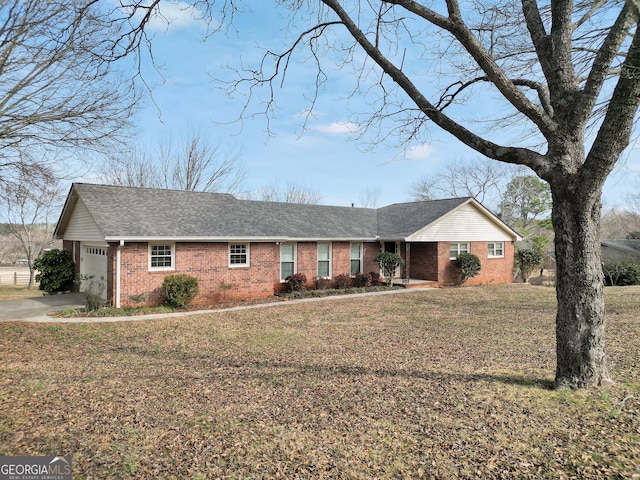 single story home with a garage and a front yard