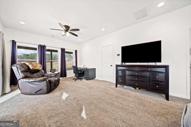 living room featuring light colored carpet and ceiling fan