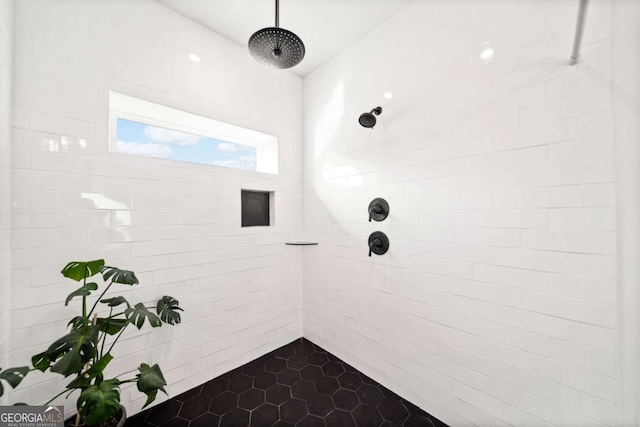 bathroom with a tile shower