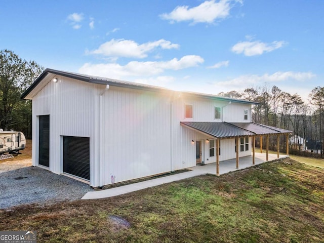 exterior space with a garage and a yard