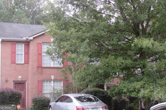 view of front of property featuring brick siding