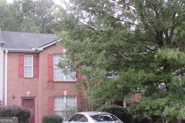 view of property exterior featuring brick siding