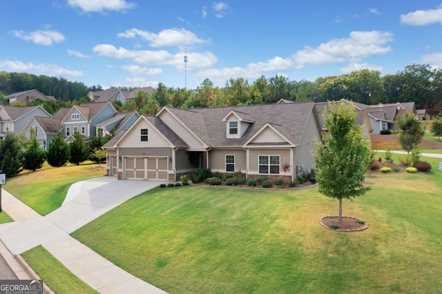 view of front of house with a garage and a front yard