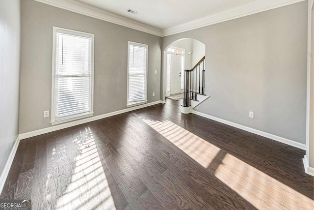 interior space featuring crown molding and dark hardwood / wood-style floors